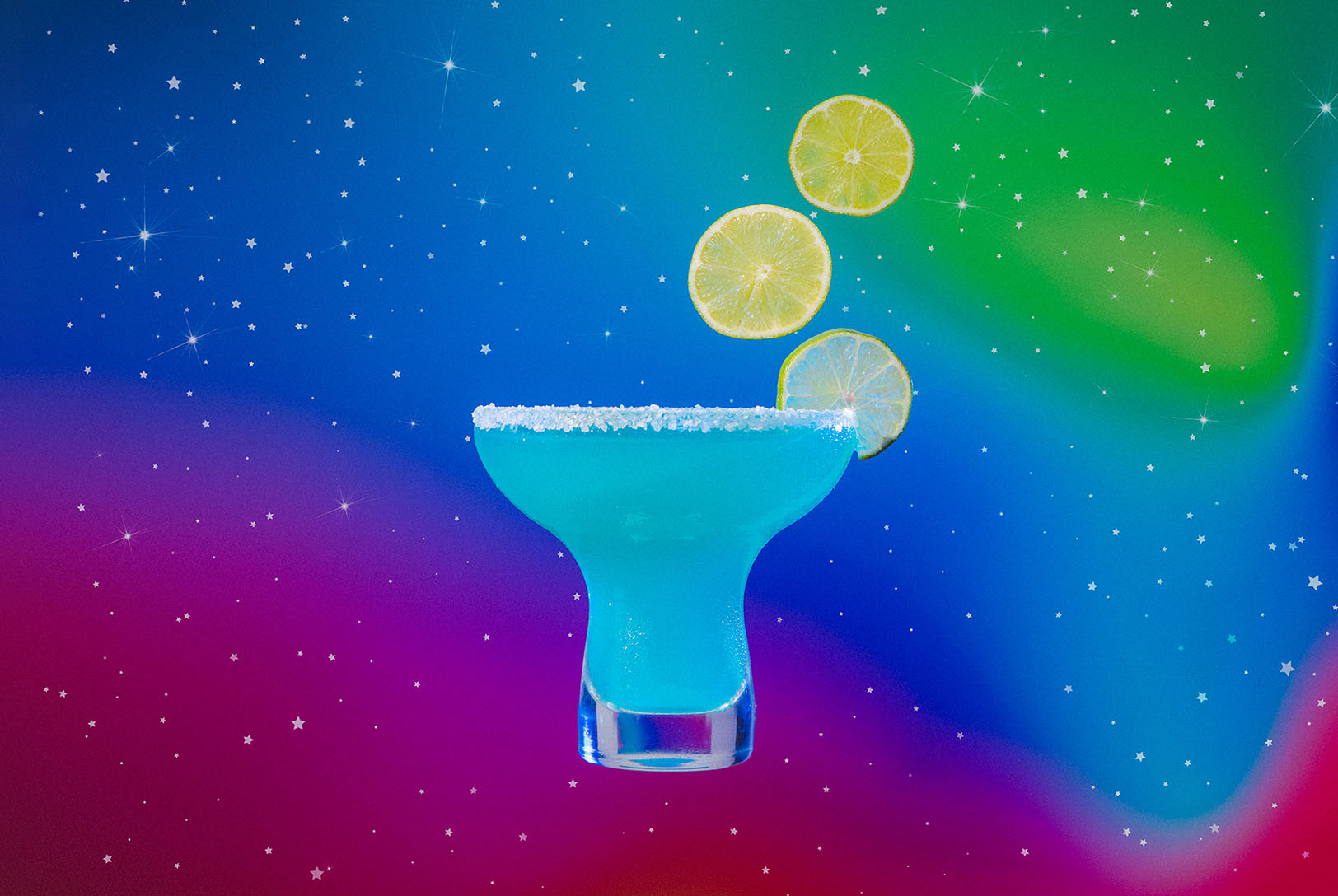 Aquarius zodiac inspired frozen blue margarita with floating lime garnish in cosmic surroundings