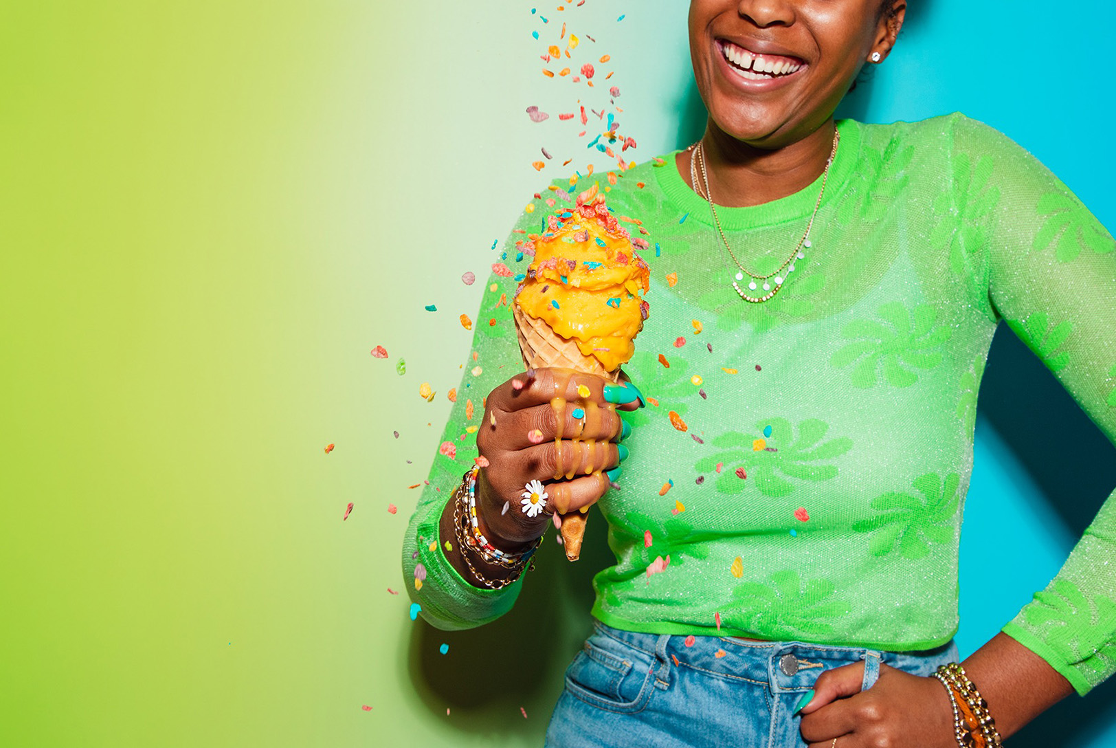 person holding mango gelato in cone