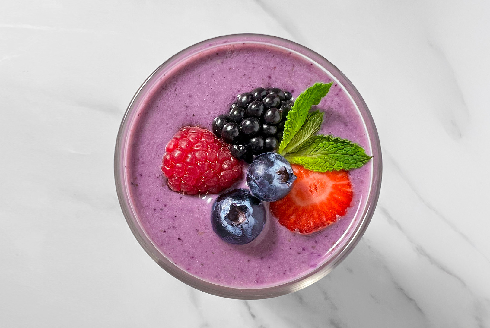 Black nutribullet Flip with berries, honey, and almond milk