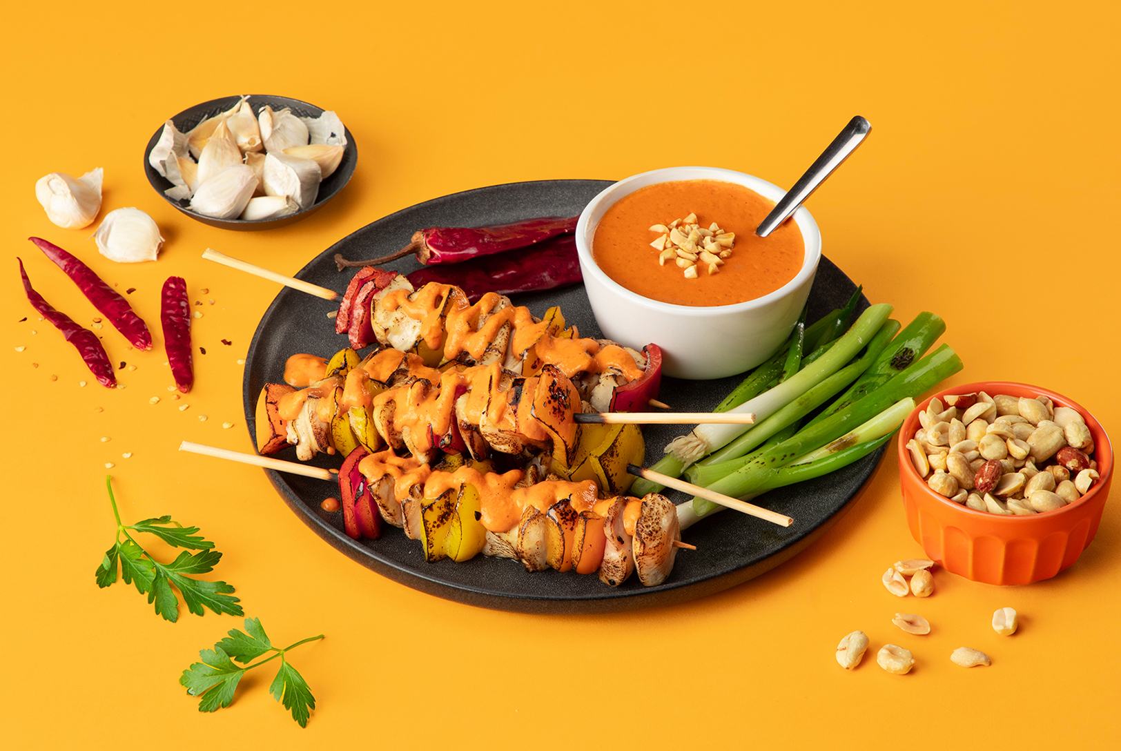 vegetable kabobs with spicy peanut sauce, hot peppers, peanuts, and garlic