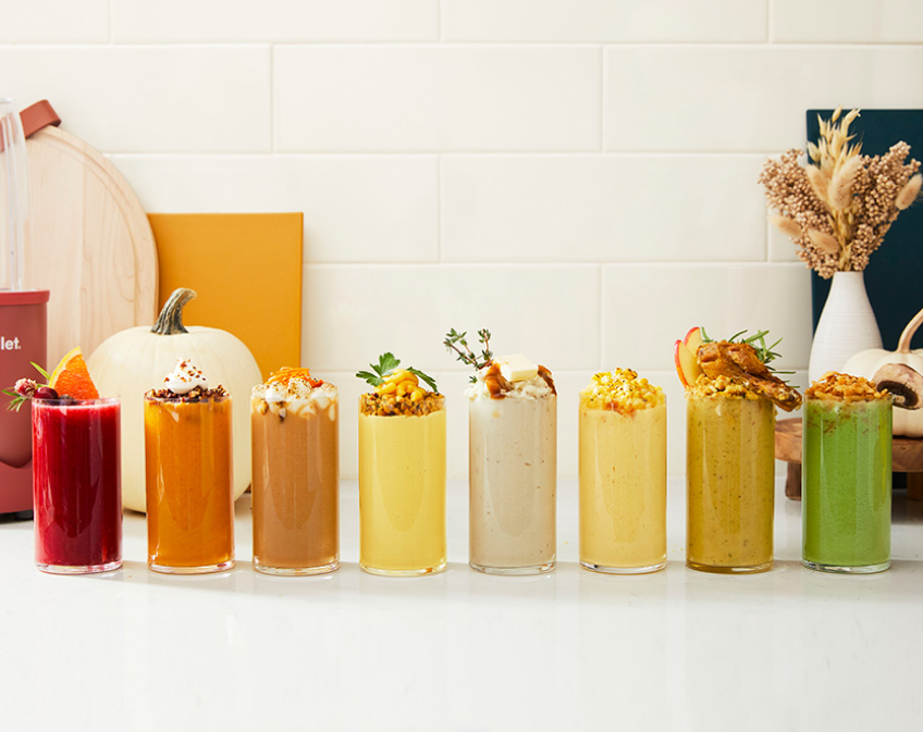 Row of multi-colored smoothies on counter top
