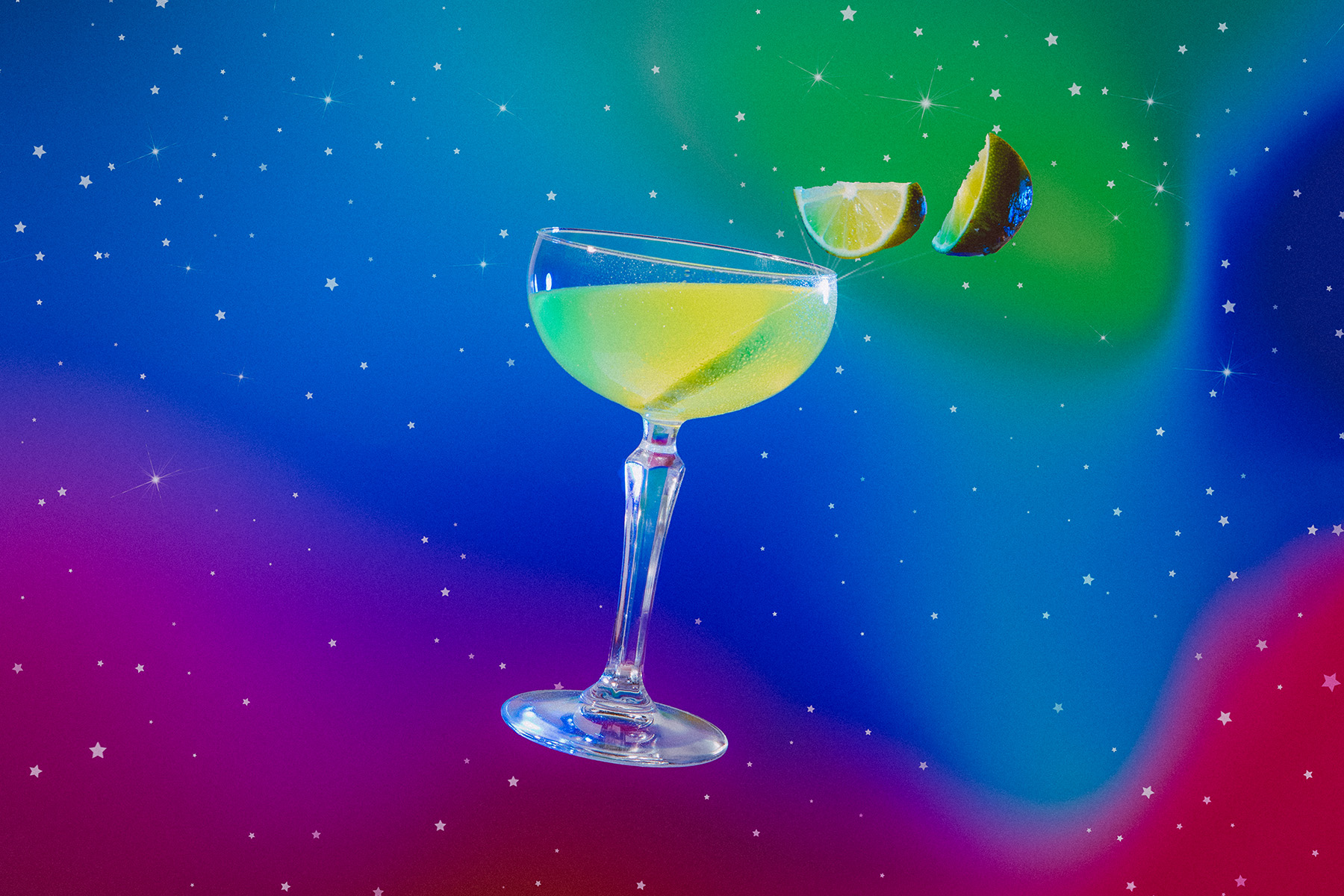 virgo inspired gin, chartreuse, maraschino liqueur, and lime juice cocktail with floating lime slices in cosmic surroundings