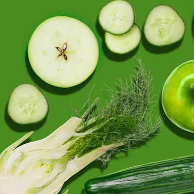 green apple, fennel, and cucumber on green background