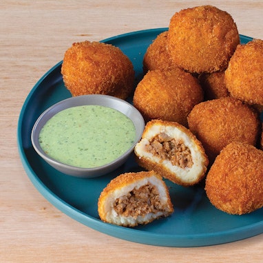 plate of beef potato balls with dipping sauce