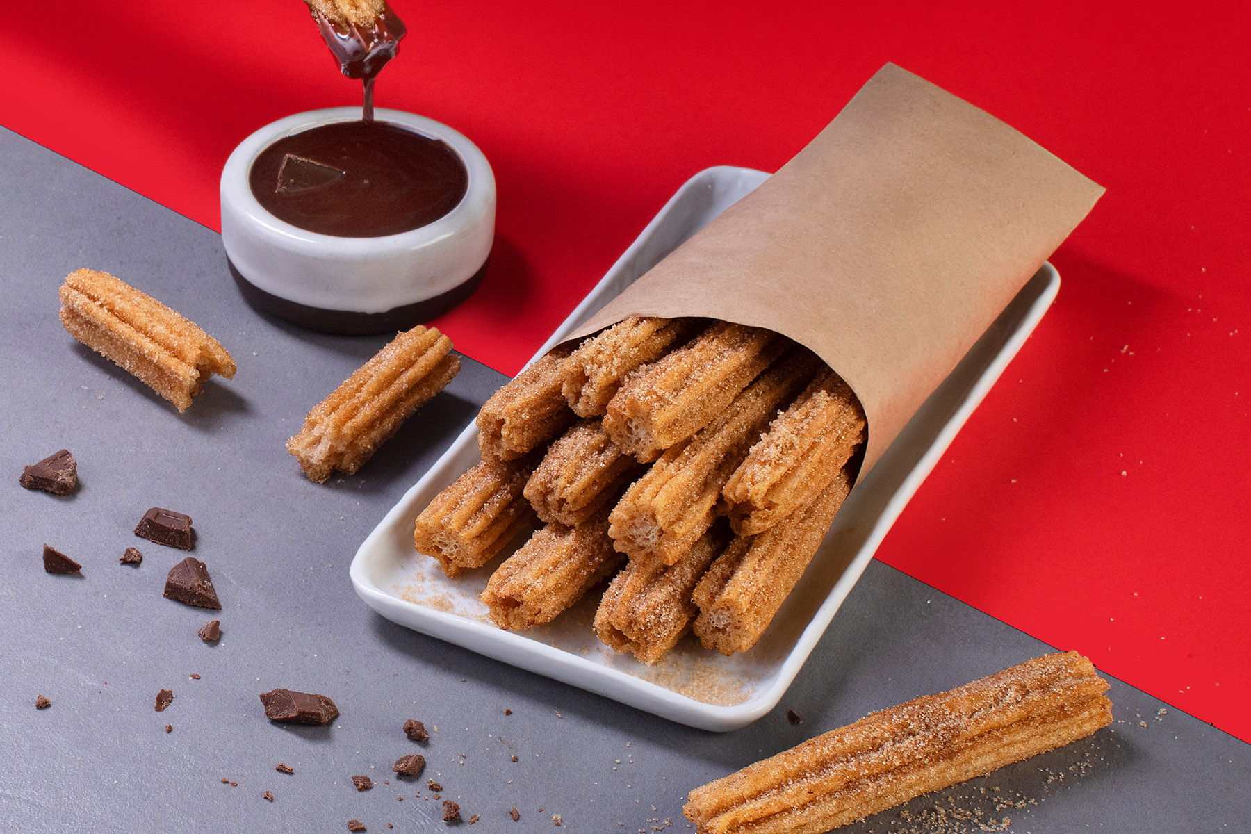 bag of churros with chocolate dipping sauce