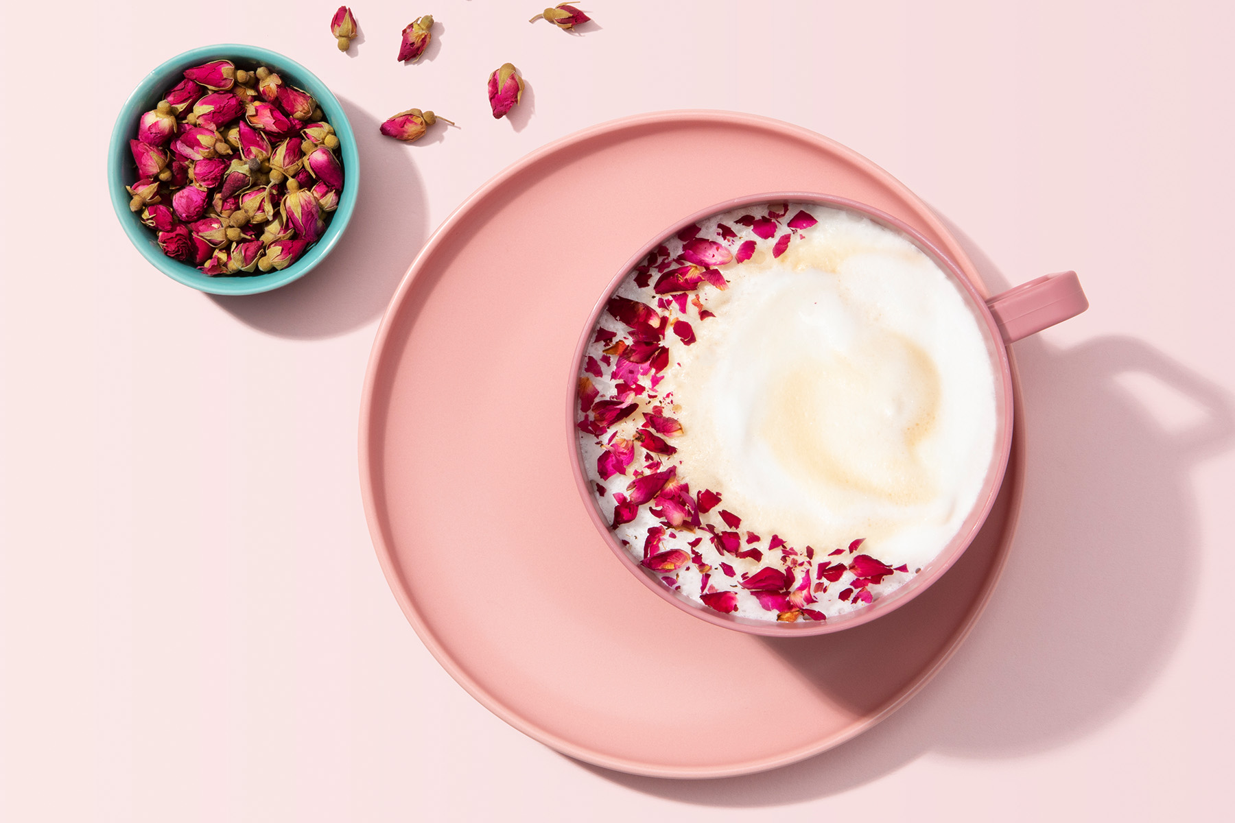 mug of rose vanilla latte with dried rose petals
