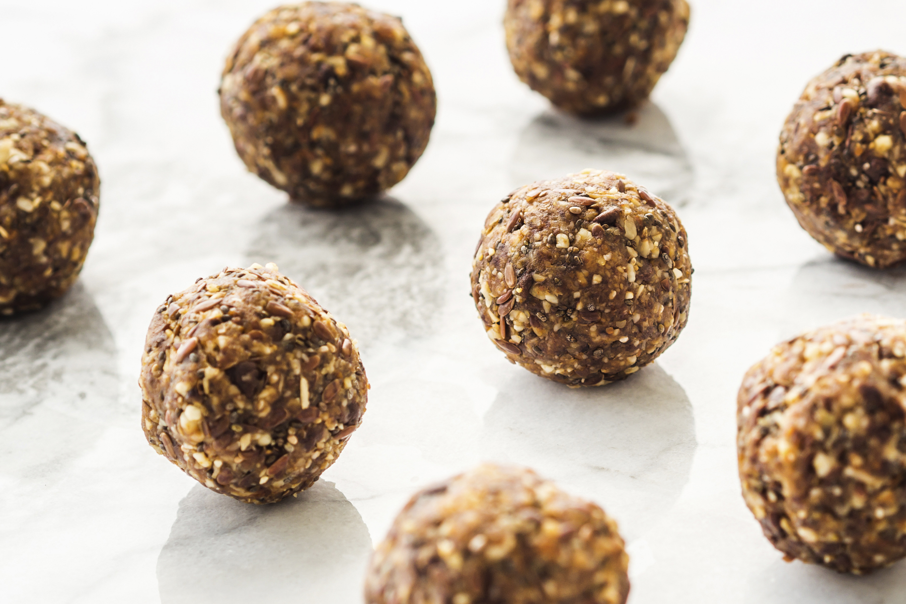 rows of energy bites made with coffee, oats, dates, and almonds