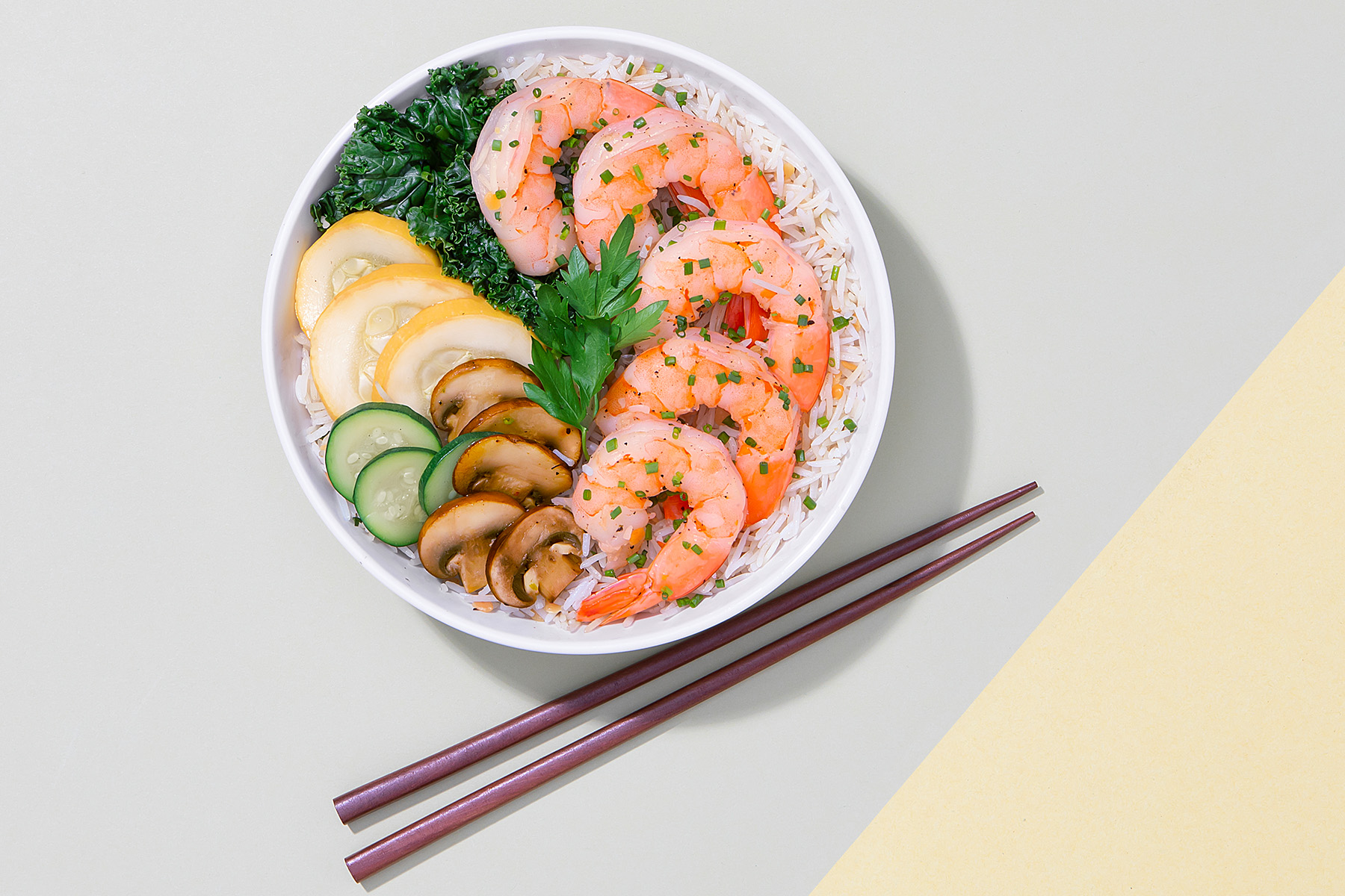 rice and lentil bowl with shrimp, mushroom, zucchini and kale