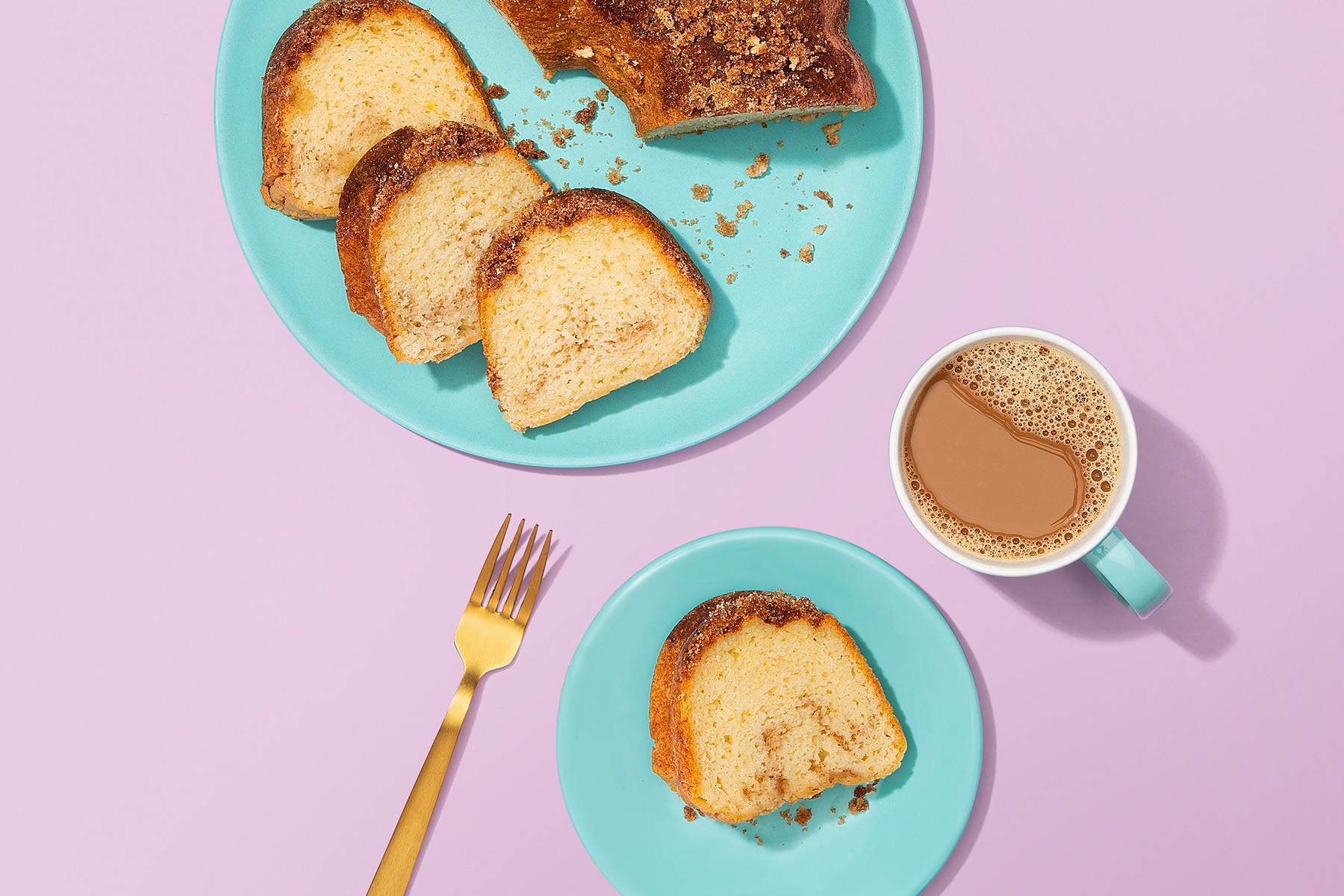 slices of coffee cake with a mug of coffee on the side