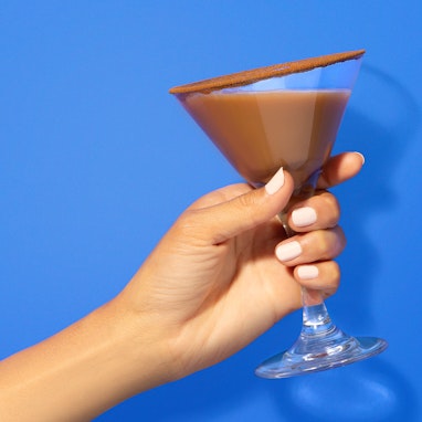 hand holding horchata coffee blend in martini glass
